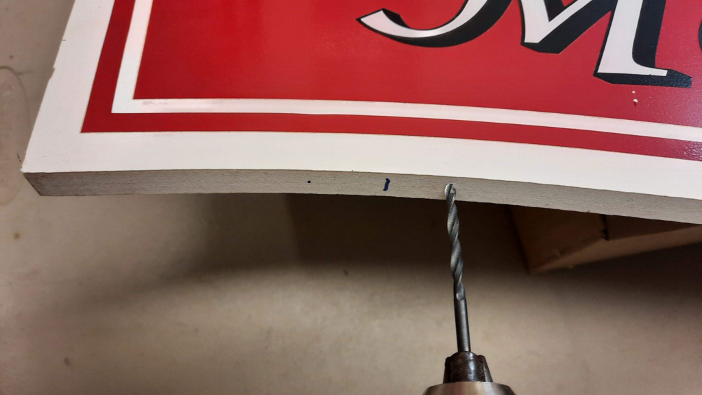 attaching hanging hardware to top of sign