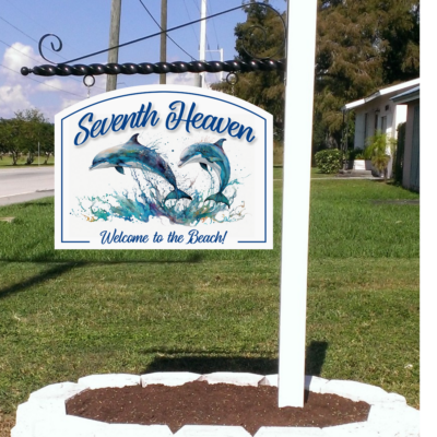 beach house sign with color water graphics